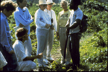 A local resident talking to a group of visitors.