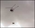 The helicopter heads away to the dropoff point at the north of the island. Click to enlarge : Image - Heurisko Ltd