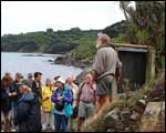 Ray explains the special features of the island sanctuary to the visitors. Click to enlarge : Image - Heurisko Ltd. Camera provided by Lacklands Ltd.